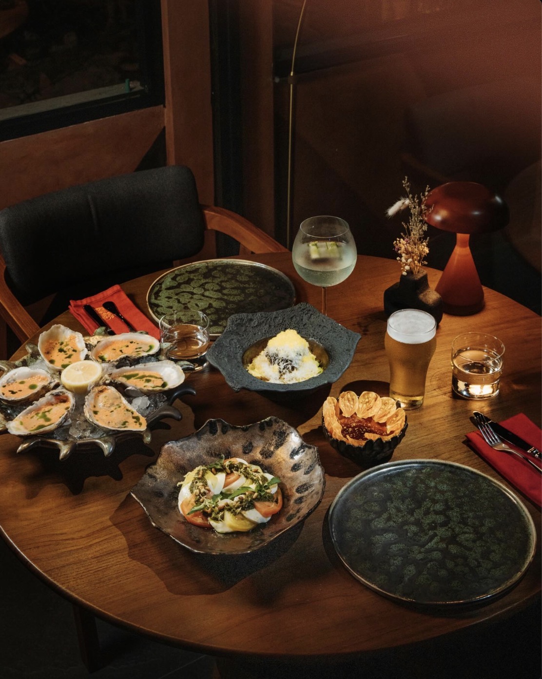 FERRO Grill signature table — oysters, burrata and a garden gin cocktail